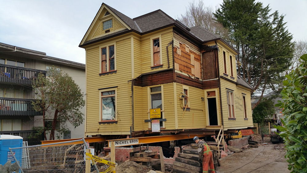 Heritage home being raised